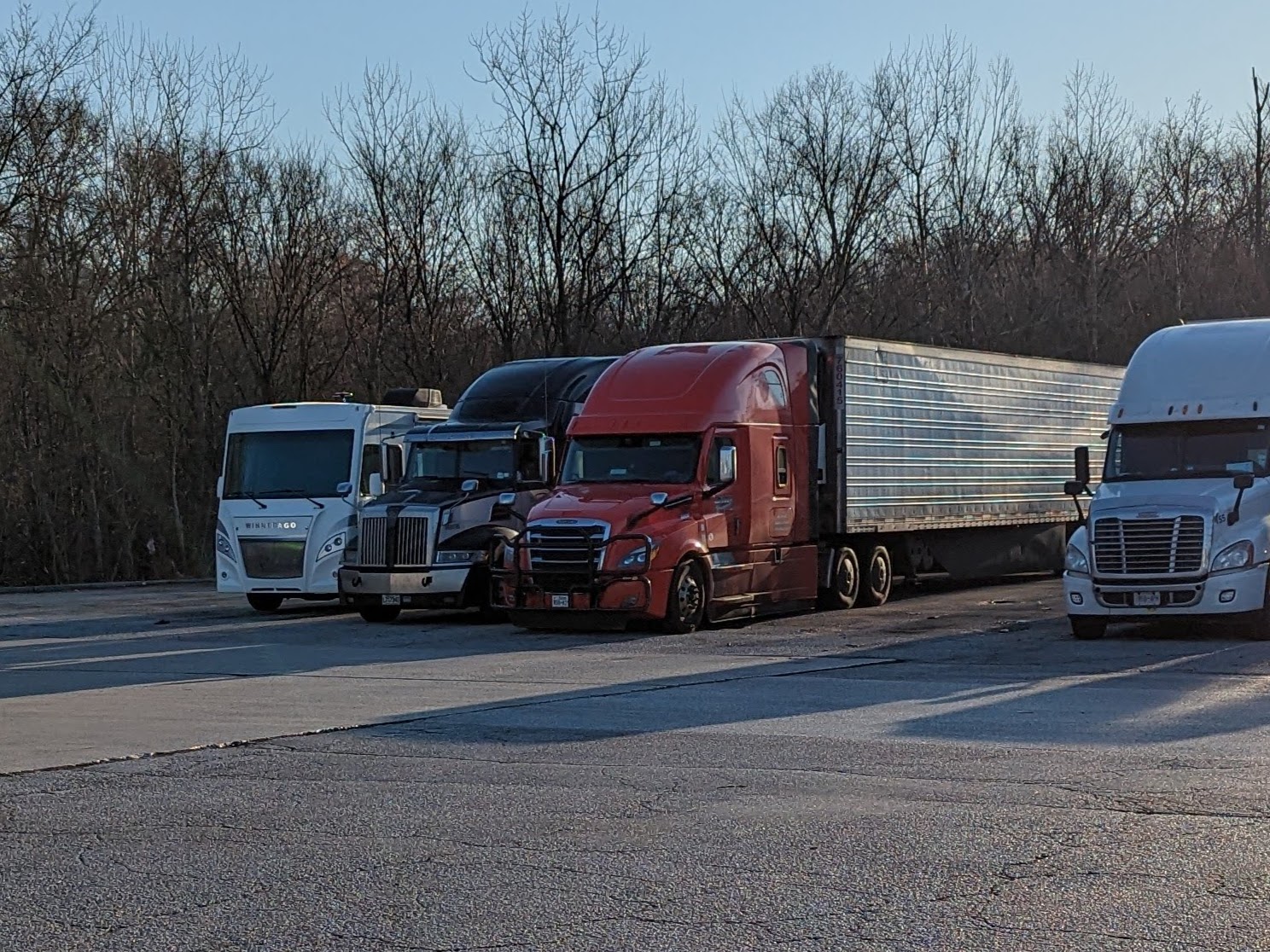 The House Nestled in with the Tractor Trailers